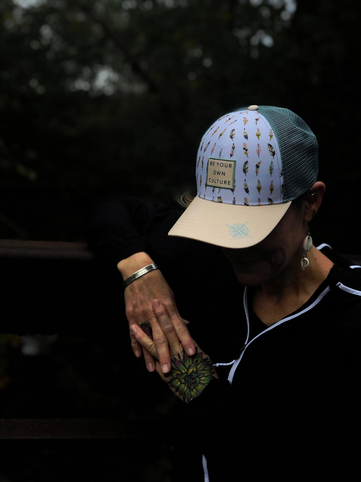 'Be Your Own Culture' Running Trucker Hat - Feathers