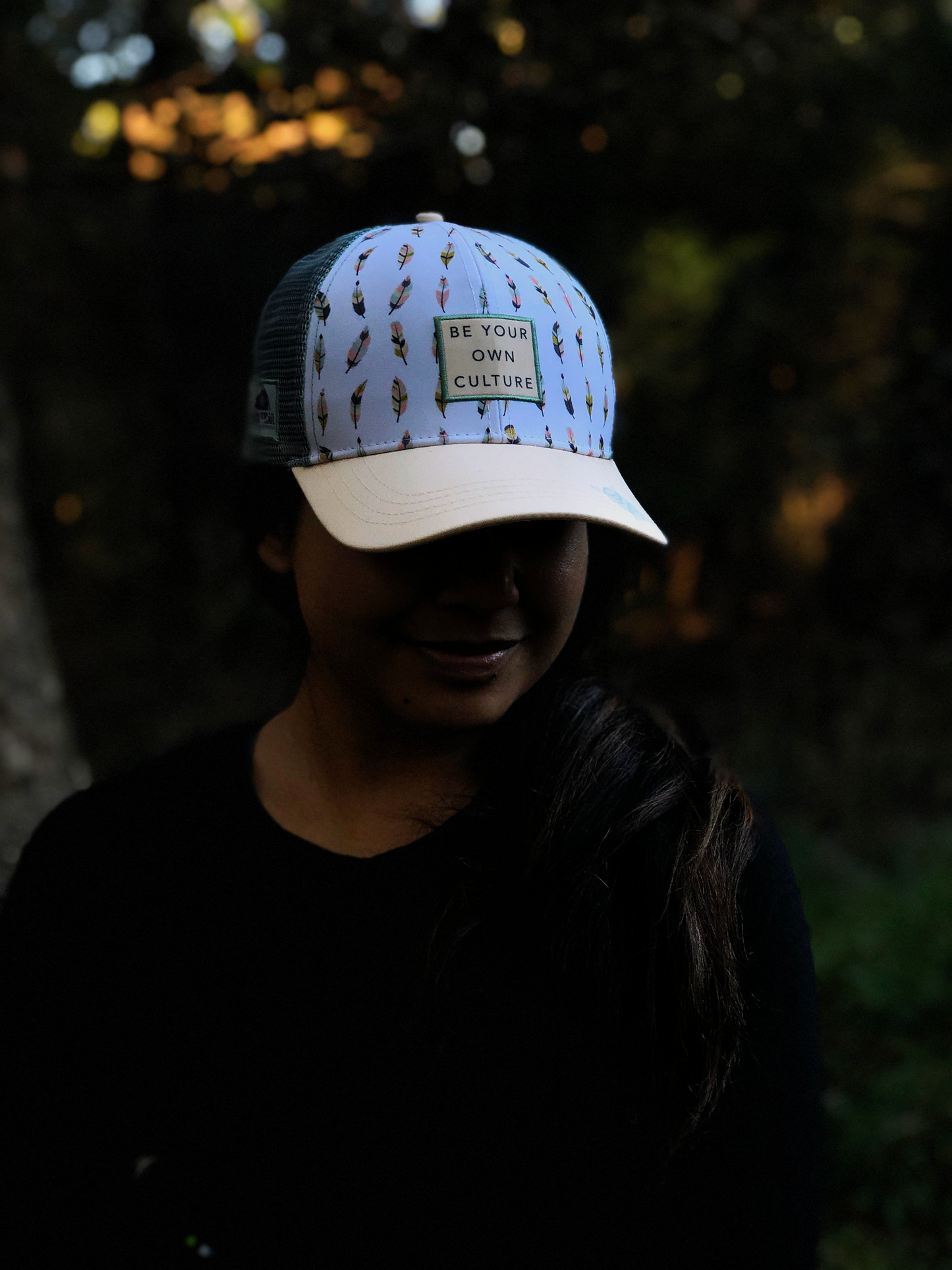 'Be Your Own Culture' Running Trucker Hat - Feathers