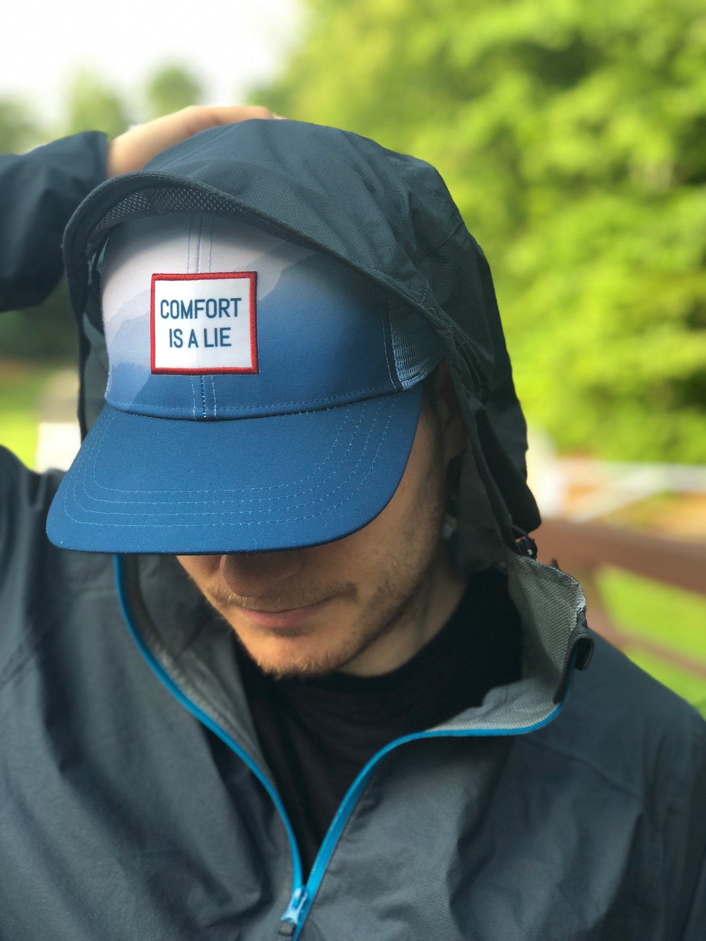 'Comfort Is A Lie' Running Trucker Hat - Fog