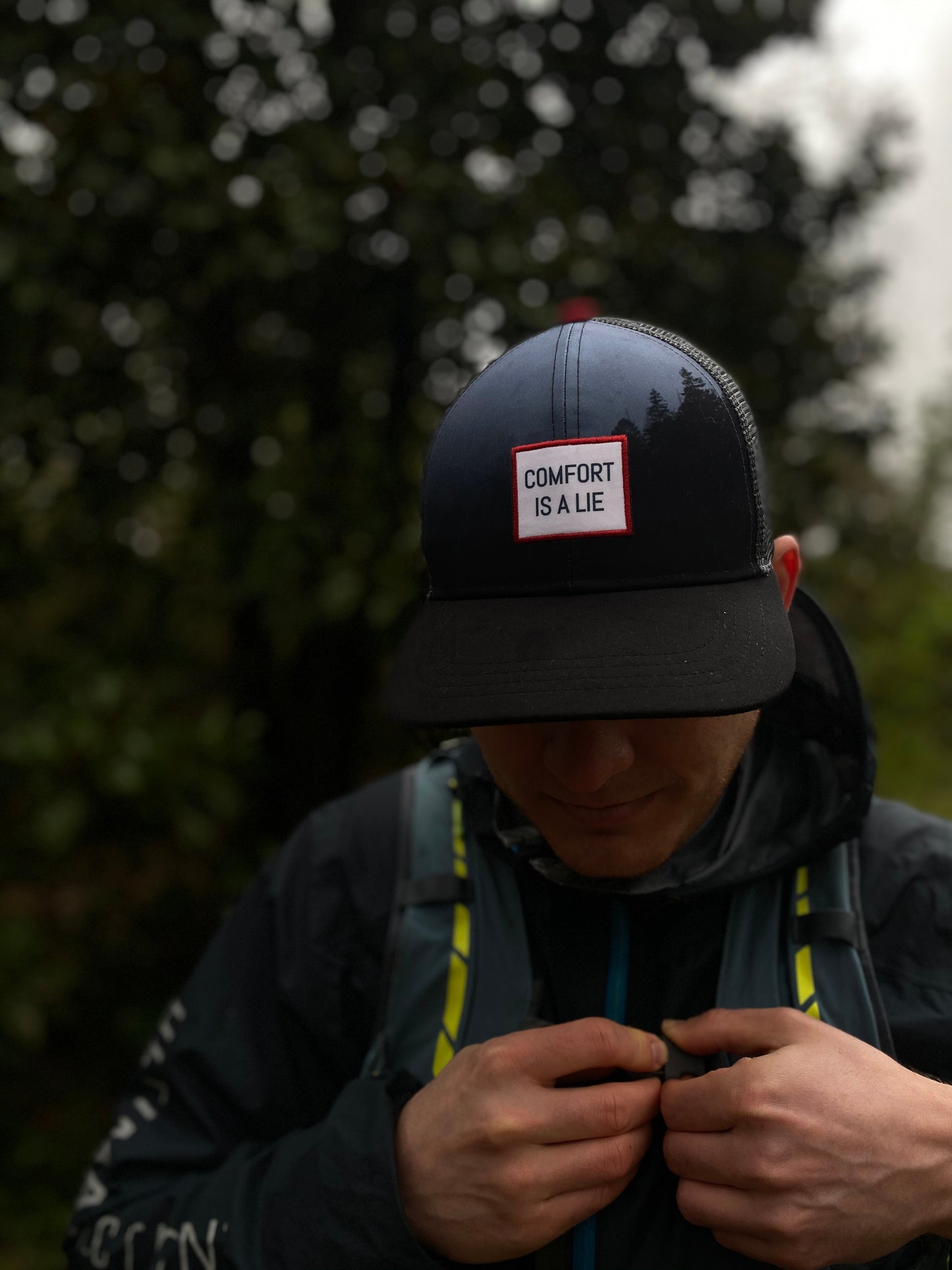 'Comfort Is A Lie' Running Trucker Hat - Night