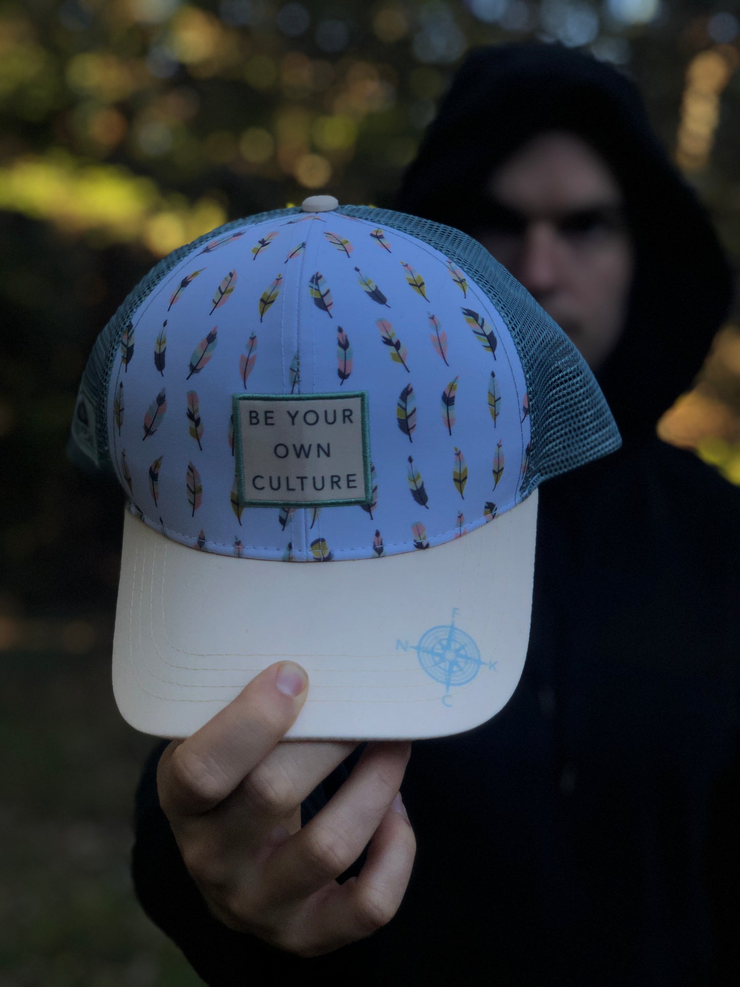 'Be Your Own Culture' Running Trucker Hat - Feathers