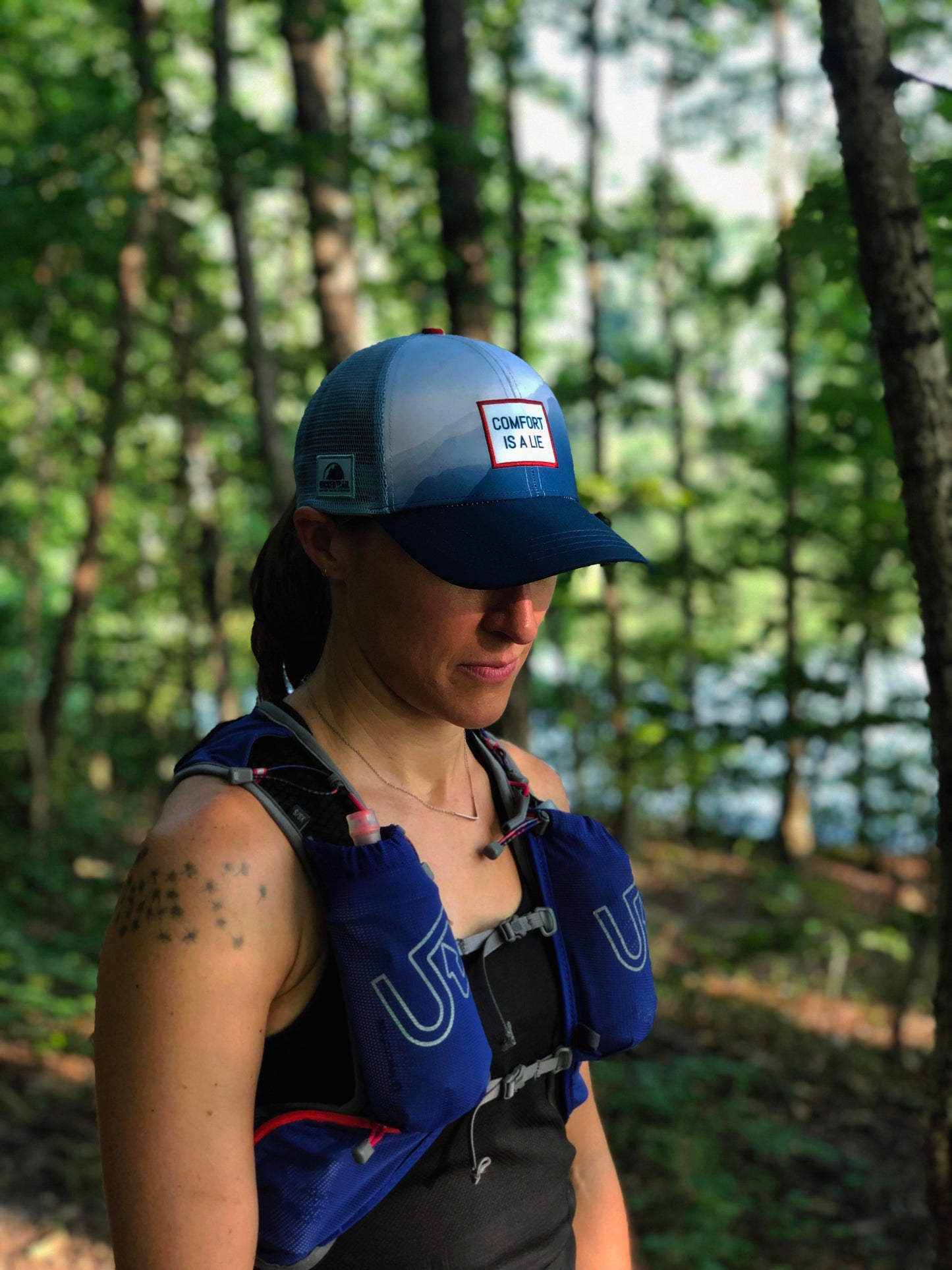 'Comfort Is A Lie' Running Trucker Hat - Fog