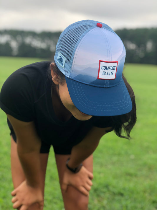 'Comfort Is A Lie' Running Trucker Hat - Fog